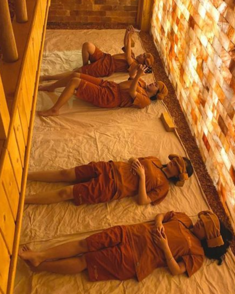 Four guests enjoying the sauna at a Korean jjimjilbang