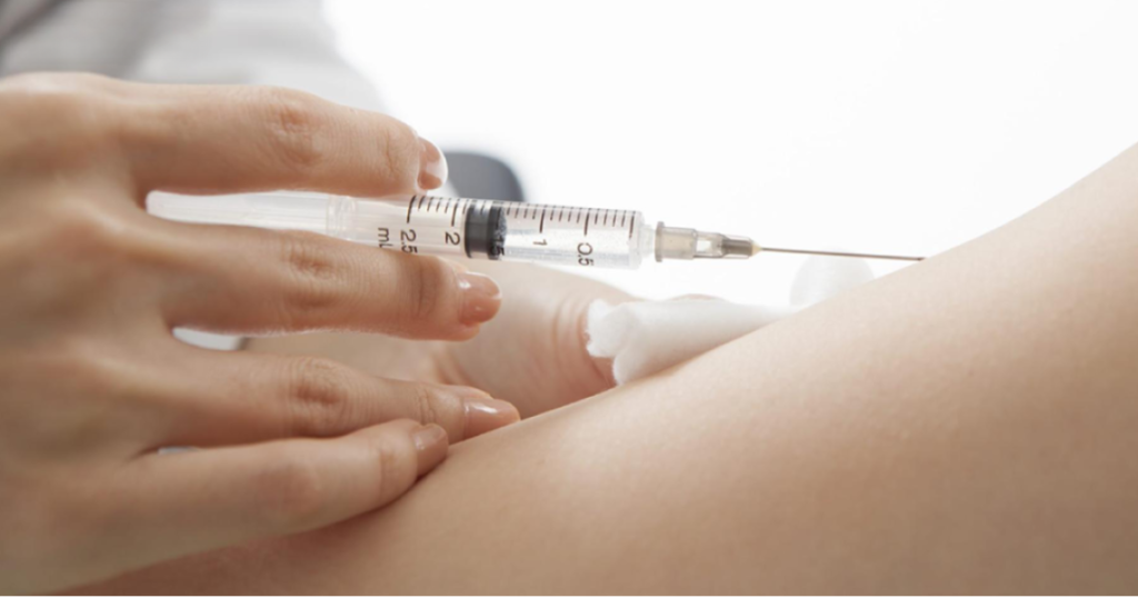 A doctor injecting a fat dissolving injectable into a patient's arm