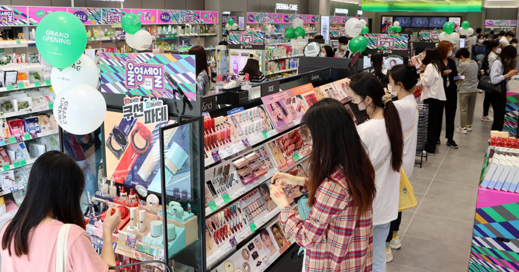 Customers browsing the aisles at Olive Young