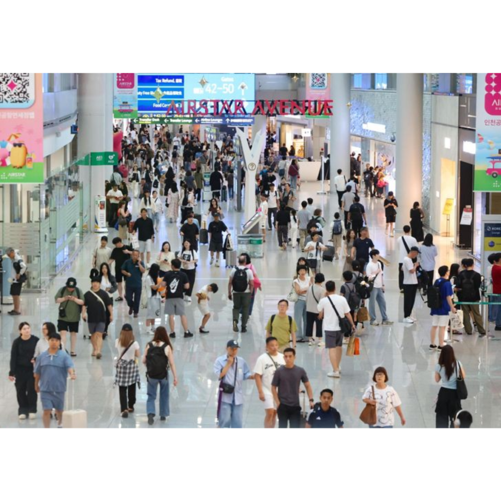 Travelers walking through Incheon Airport