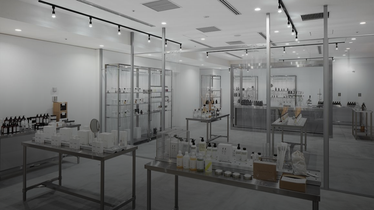 Inside of a skincare store that has a clinical lab-looking interior design.